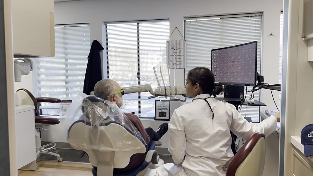 Dr. Ellen speaking with patient during dental visit in comfortable treatment room