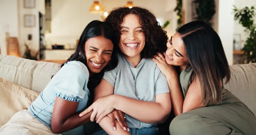 Group of women smiling together, representing confident smiles after sedation dentistry