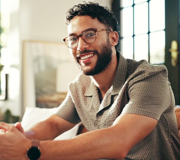 Smiling man with healthy teeth, representing successful dental treatment results
